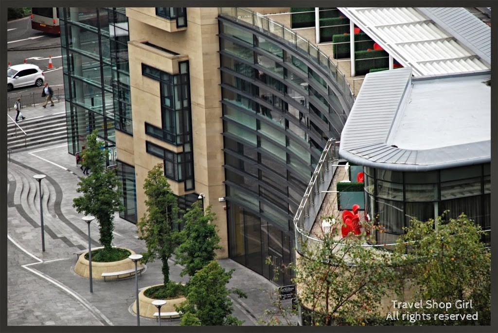 One side of the hotel with suites at the top - love those red chairs!