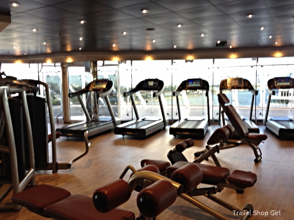 Treadmills and strength training equipment inside the fitness center